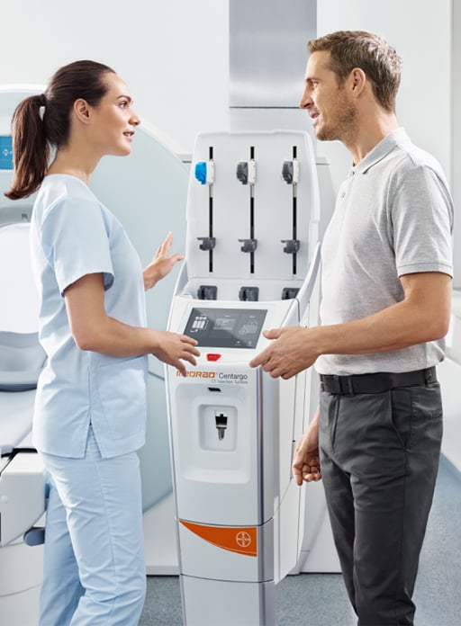 Healthcare workers talking about MEDRAD<sup>®</sup> Centargo