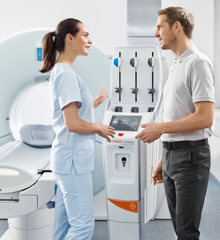 Healthcare workers talking about MEDRAD<sup>®</sup> Centargo